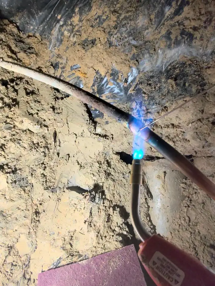 Slab leak repair: brazing the copper line in the tunnel under the foundation, Plano