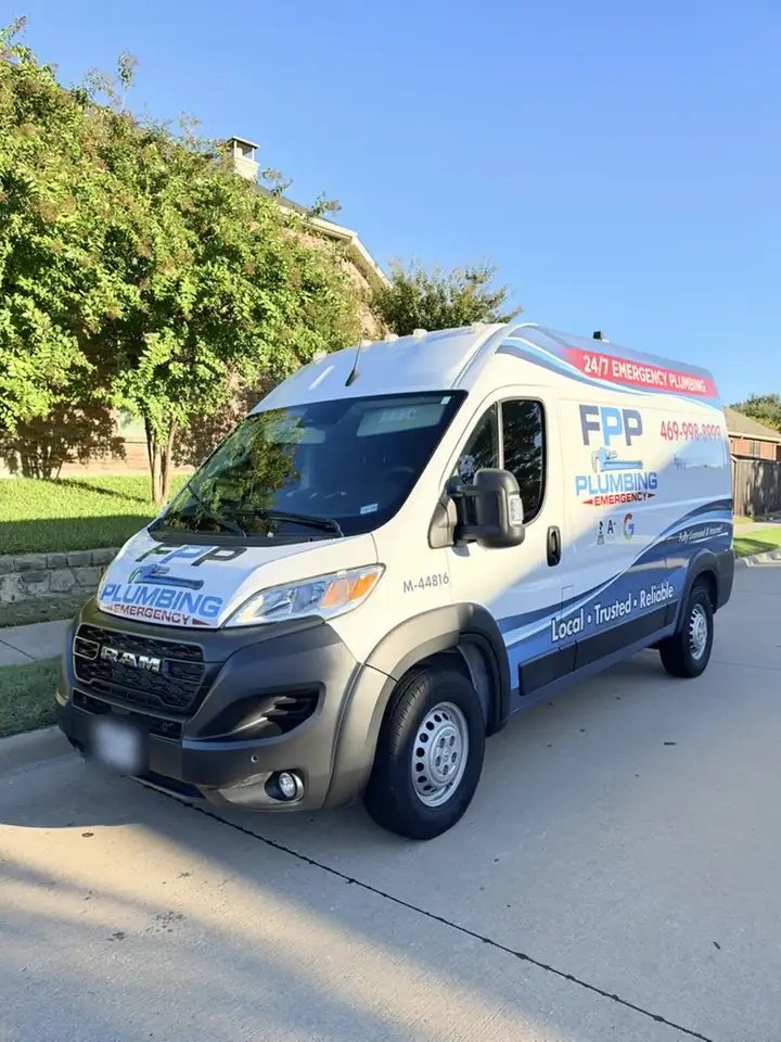 FPP Plumbing van parked at the curb of a residential street in McKinney, 24/7 emergency plumbing and the Frisco number on its side