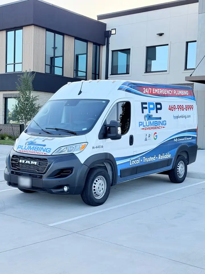 FPP Plumbing van with the Frisco phone number on it, parked at our Frisco office on Westridge Blvd