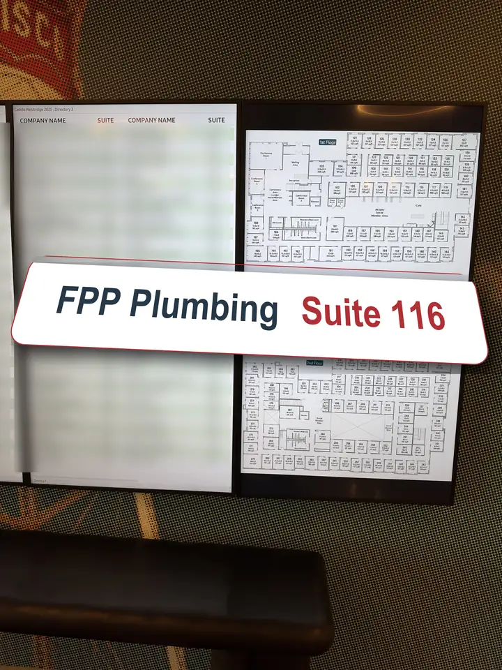 Office directory screens in the Frisco office center with a big plate reading FPP Plumbing Suite 116 coming out of the board
