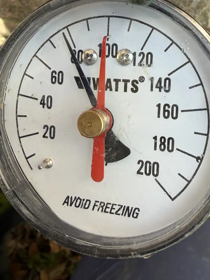 Water pressure gauge with the black needle at about 78 PSI, Plano