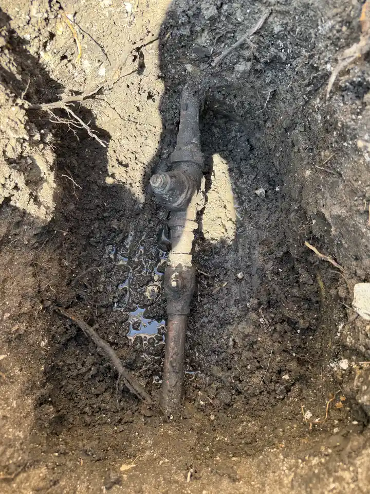 Old secondary shutoff valve and PRV buried in dirt, before replacement, Frisco