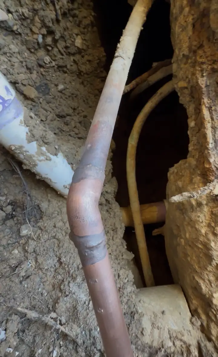 Slab leak repair: finished brazing on the copper line under the foundation
