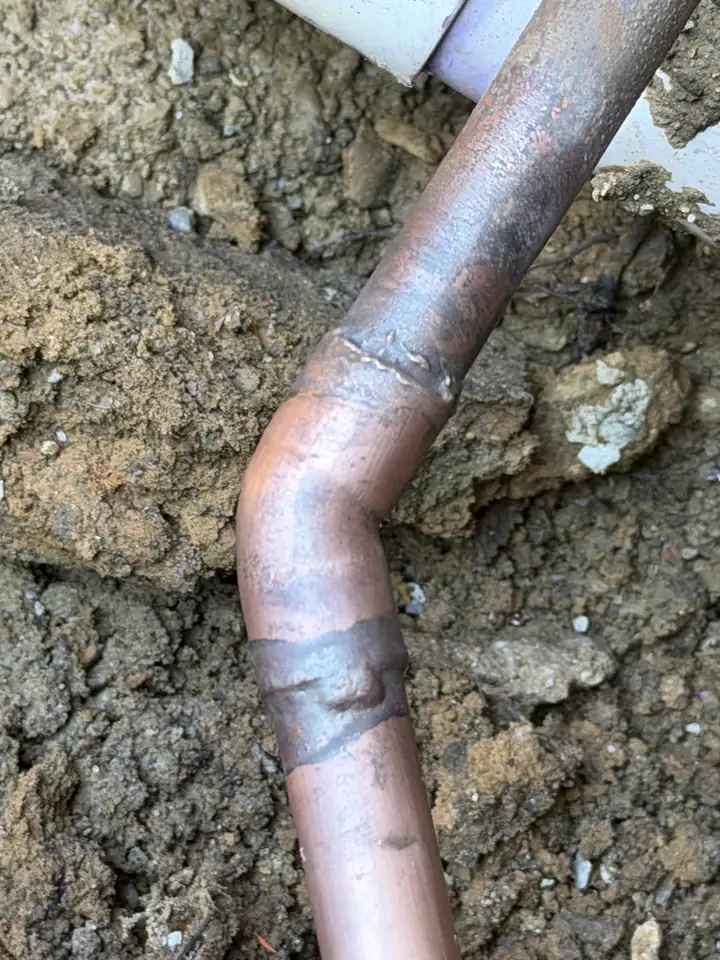 Finished brazed copper joint on a slab leak repair under the foundation, Carrollton