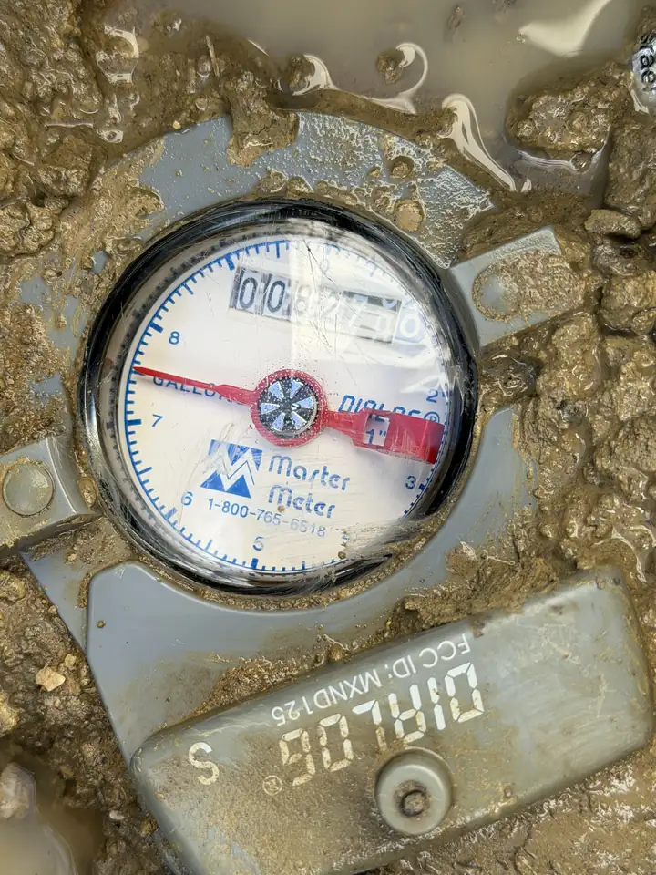 Water meter with the leak indicator turning, leak detection, The Colony