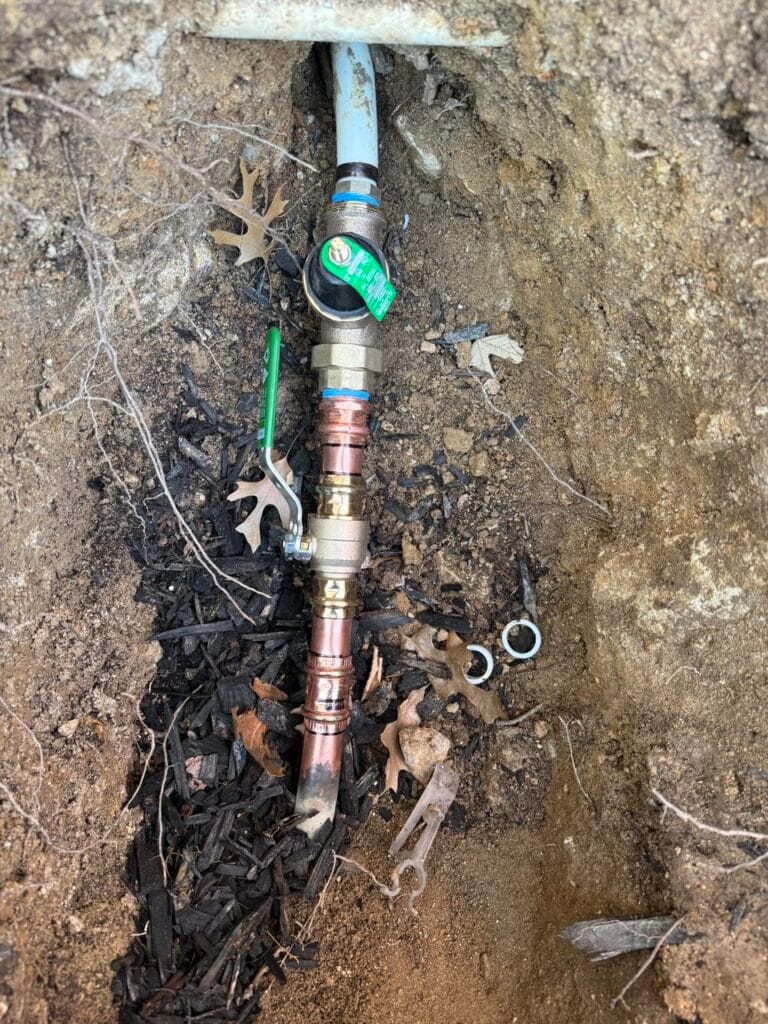 Underground copper water line with PRV valve and main shut-off valve during emergency repair in Frisco