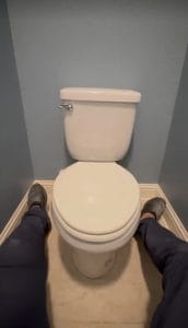 Plumber preparing for toilet replacement before installation