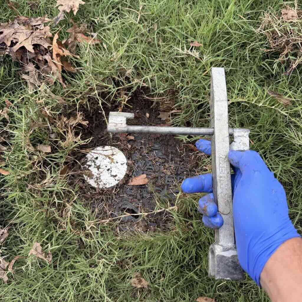 Water meter box lid key opening the main water meter box