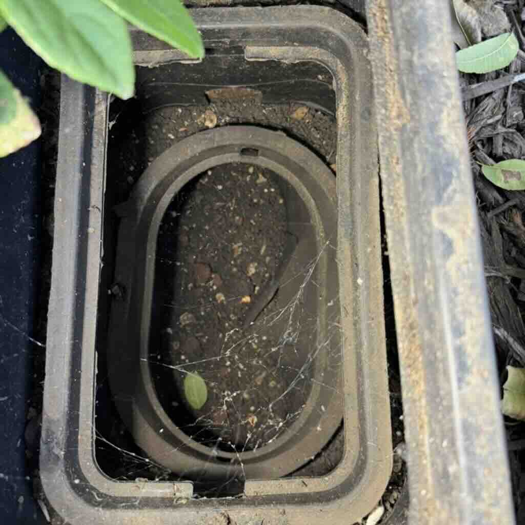 Buried shutoff valve box filled with dirt and hard to access