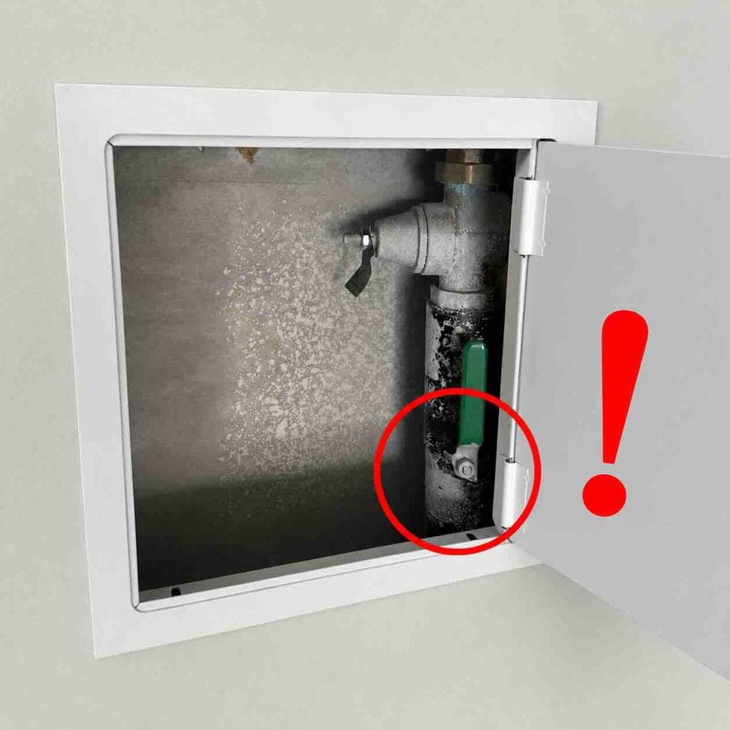 Garage water shutoff panel with the shutoff valve marked in red next to the PRV