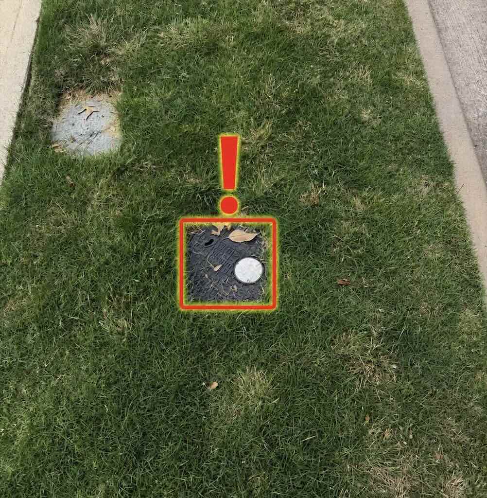 Main water meter box and shutoff valve near the street