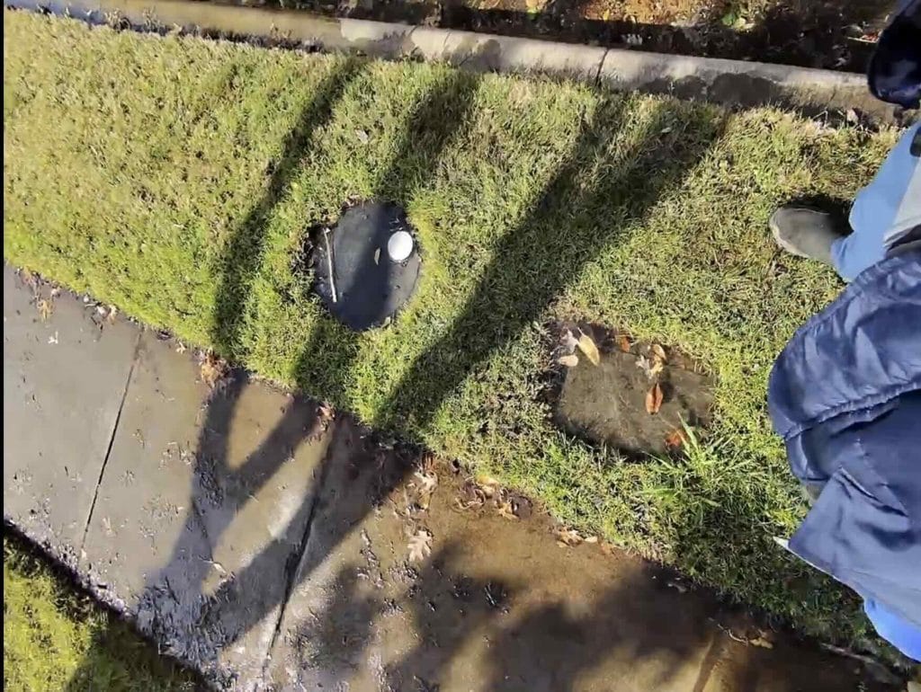 water leak at water meter box in yard