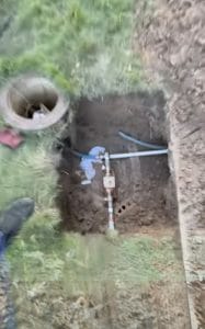 backflow preventer exposed under sidewalk plano tx water line repair
