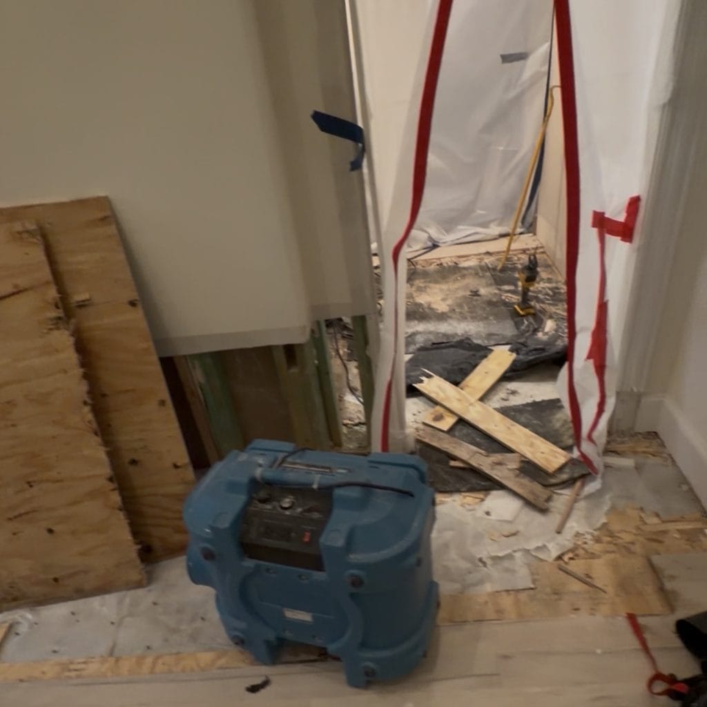Water restoration work area after bathroom leak damage in Frisco TX